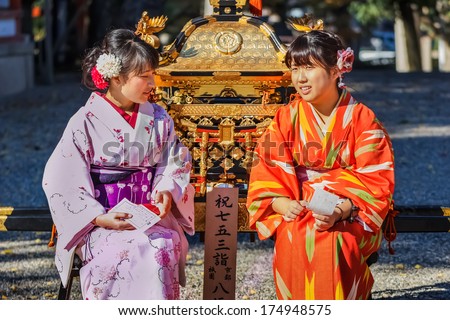 KYOTO, JAPAN - NOVEMBER 18: Japanese women in Kyoto, Japan on November 18, 2013. Unidentified Japanese women dress up Kimono to pay respect to Yasaka Shrine