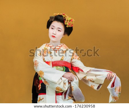 KYOTO, JAPAN - NOVEMBER 18: Kyomai Dance  in Kyoto, Japan on November 18, 2013. Unidentified Geisha performs Kyomai dance which adopted the elegance and of the imperial court manner