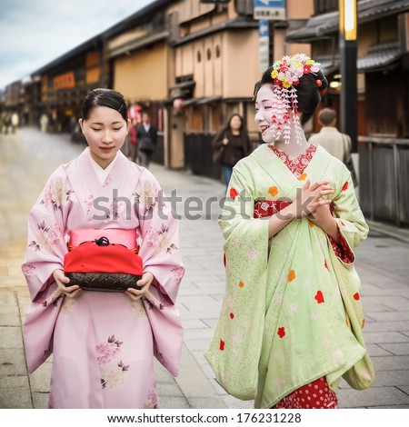 KYOTO, JAPAN - NOVEMBER 18: Maiko in Kyoto, Japan on November 18, 2013. Apprentice geisha in western Japan, especially Kyoto. Their jobs consist of performing songs, dances, and playing the shamisen