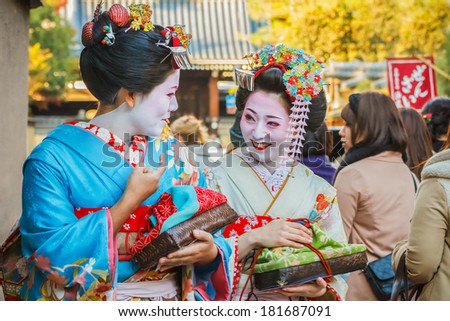 KYOTO, JAPAN - NOVEMBER 20: Maiko in Kyoto, Japan on November 20, 2013. Apprentice geisha in western Japan, especially Kyoto. Their jobs consist of performing songs, dances, and playing the shamisen
