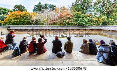 KYOTO, JAPAN - NOVEMBER 20: Ryoanji in Kyoto, Japan on November 20, 2013. A Zen Rock Garden in Ryoanji Temple in a garden with fifteen stones on white gravel