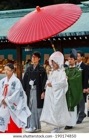 TOKYO, JAPAN - NOVEMBER 23: Wedding Ceremony in Tokyo, Japan on November 23, 2013. Unidentified groom and bride attend a japanese traditional  wedding ceremony at Meiji-jingu shrine