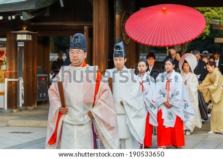 TOKYO, JAPAN - NOVEMBER 23: Wedding Ceremony in Tokyo, Japan on November 23, 2013. Unidentified groom and bride attend a Japanese traditional wedding ceremony at Meiji-jingu shrine