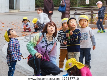 TOKYO, JAPAN - NOVEMBER 25: Ueno Park in Tokyo, Japan on November 25, 2013. Teachers of a kindergarten take a group of young student out for bird observation at Ueno Park