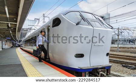 KYOTO, JAPAN - OCTOBER 20: Haruka Train in Kyoto, Japan on October 20, 2014. Unidentified Japanese train conductor prepares to operate the Haruka airport express train in Kyoto station