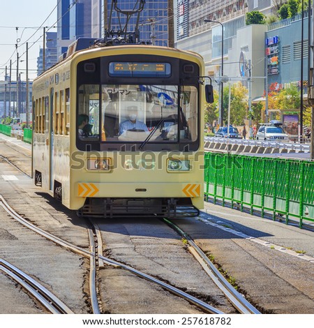 OSAKA, JAPAN - OCTOBER 24: Hankai Tram in Osaka, Japan on October 24, 2014. The Hankai Tramway in Osaka is affectionately known as the chin chin densha (ding ding train).