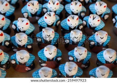 OSAKA, JAPAN - OCTOBER 24: Good Luck Charms in Osaka, Japan on October 24, 2014. Japanese charms commonly sold at religious sites Shinto and Buddhist, provide various forms of luck or protection.
