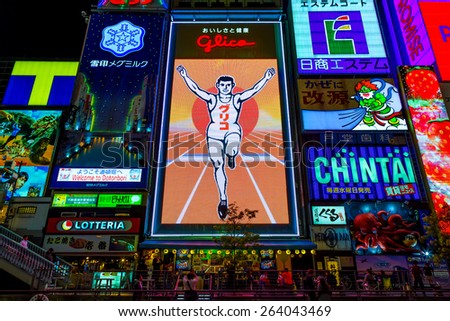 OSAKA, JAPAN - OCTOBER 24: Glico Man in Osaka, Japan on October 24, 2014. Replacing the old neon lights, the 6th gen. of the billboard uses 140,000 LED in total, allows new animated background scenes