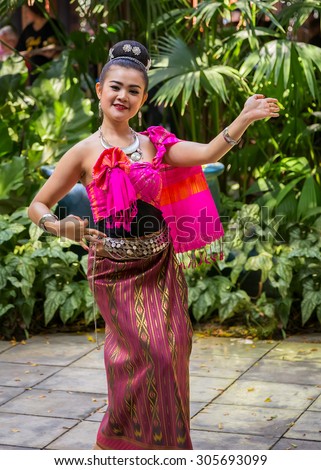 BANGKOK, THAILAND - DECEMBER 30: Thai Traditional Dance in Bangkok, Thailand onDecember 24, 2014. Unidentified Thai woman performs a traditional Thai dance in a garden
