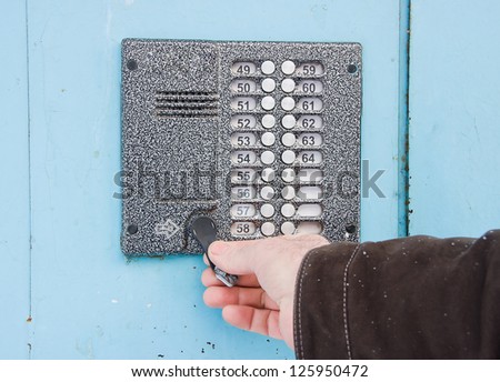 a hand opens the key a door