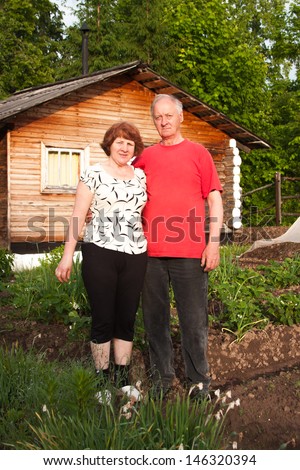 domestic elderly pair on nature by a sunny canicular day