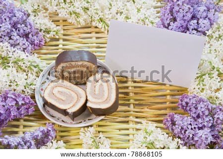 designer background from the twigs of willow, flowers  of lilac and meat loaf