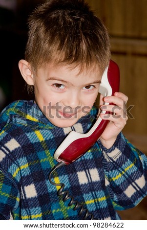 boy with an old telephone in hands