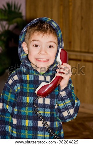 boy with an old telephone in hands