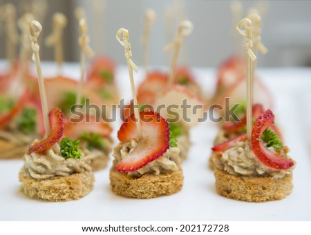 Plate of many mini bite size sandwich appetizers
