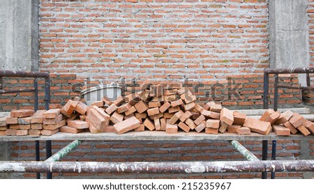 builder laying bricks in site Background of brick wall texture