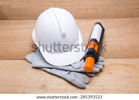 Construction tools on white background. Arrangement of hard hat, leather gloves and flashlight