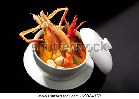 stock photo : Tom Yum spicy soup with shrimps which is known in  as tom yum