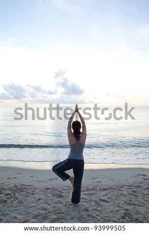 Pictures of beautiful women in the early morning yoga at sea.