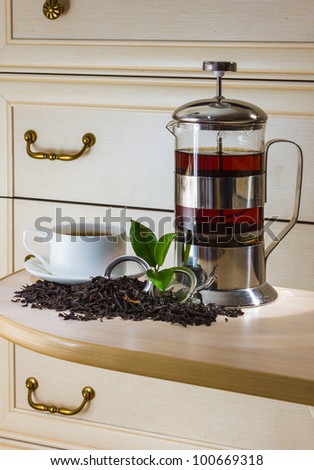 Tea and tea accessories on a background of antique furniture