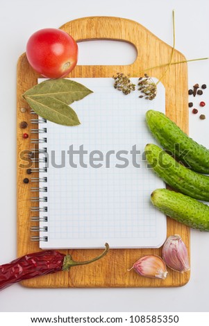 Notebook with recipes and shopping list in the kitchen