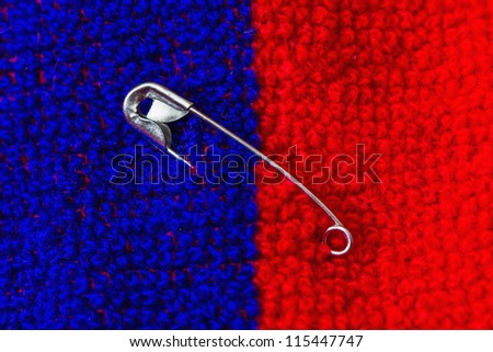 Safety pin pinned to the texture color fabric