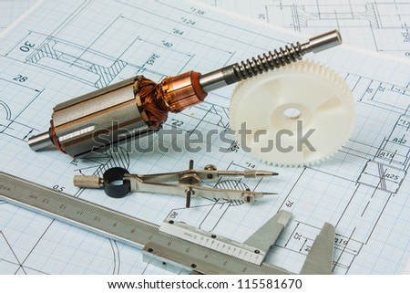 electrical components and stationery measuring tools against drawings