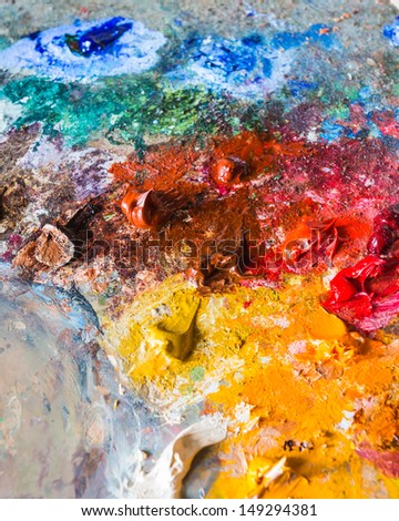 background of the artist\'s oil paints on a palette