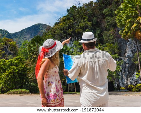 Tourists choose the route through the jungle in Thailand on Phuket Island