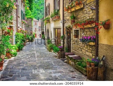 ITALY - JUNE 23, 2014: Typical Italian street in a small provincial town of Tuscan, Italy, Europe