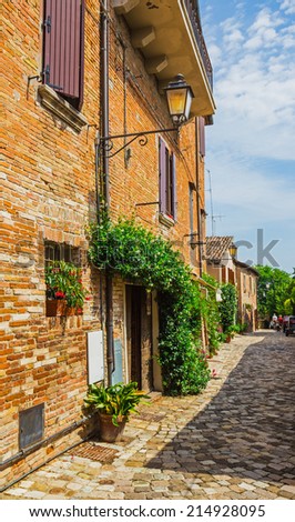 ITALY - JUNE 27, 2014: Typical Italian street in a small provincial town of Tuscan, Italy, Europe