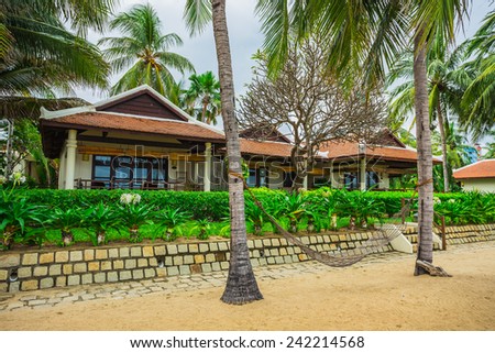 guest houses among palm trees, Southern Vietnam