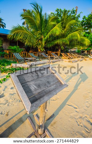 Empty old wooden Whiteboard (menu board) on a tropical beach. Thailand