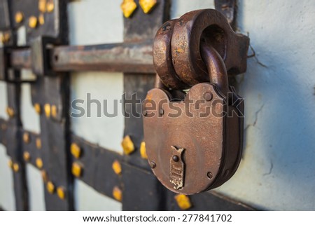 rusty lock with deadbolt on the old door