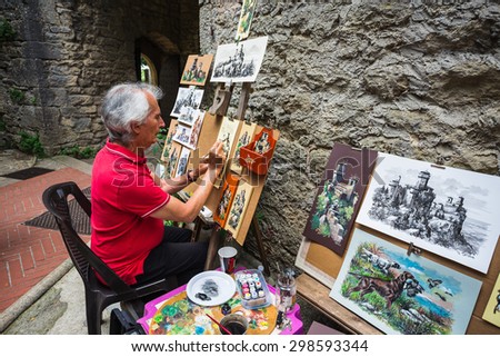 SAN MARINO REPUBLIC - JUNE 22, 2014: artist in Rocca della Guaita, the most ancient fortress of San Marino, Italy