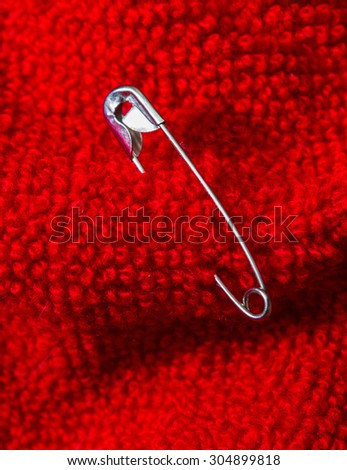 Safety pin pinned to the texture color fabric