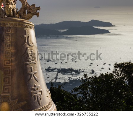 view with the bell of Big Buddha on the island and a yacht in Phuket