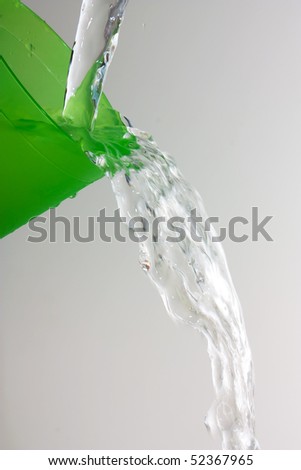 water flows from the glass Isolated on white background