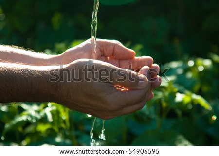 Hand washing in the summer of cool clean water