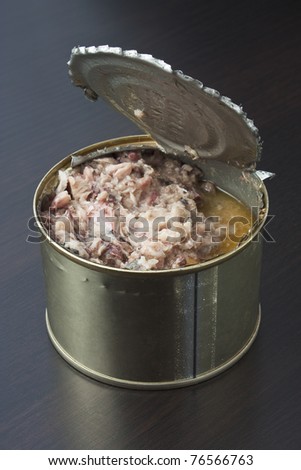 Bank of canned fish on the table