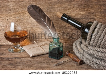 bottle of wine wrapped in a rope against the old wooden boards