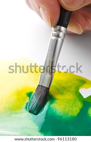 painting paint brush on a white paper