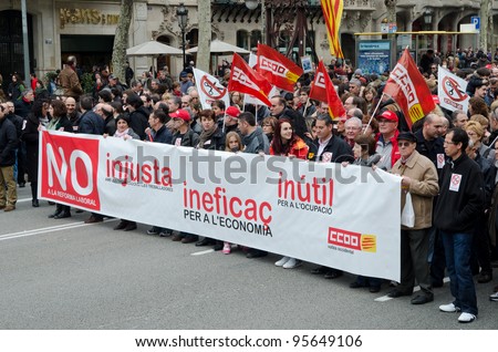 BARCELONA, SPAIN - FEBRUARY 19: hundreds of thousands of people across Spain demonstrate against the conservative governments new labor laws. Passeig de Gracia on February 19, 2012 in Barcelona, Spain