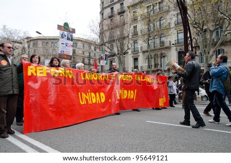 BARCELONA, SPAIN - FEBRUARY 19: hundreds of thousands of people across Spain demonstrate against the conservative governments new labor laws. Passeig de Gracia on February 19, 2012 in Barcelona, Spain