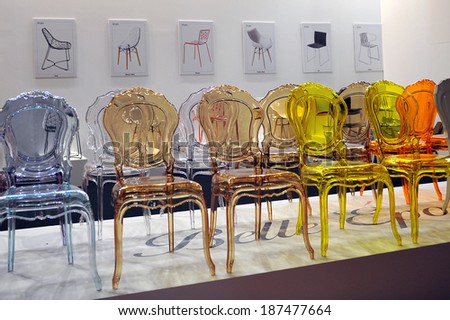 MILAN, ITALY - APR 9: Chairs transparent at Salone del Mobile, international furnishing accessories exhibition in Milan, Italy- April 9, 2014