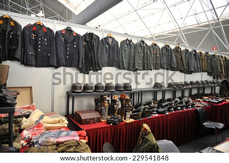 MILAN, ITALY - NOV 1: Exhibitor sitting in his stand at Militalia, exhibition dedicated to militaria collectors and military associations on November 1, 2014 in Milan.