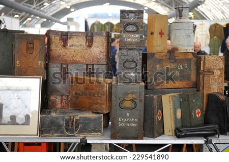 MILAN, ITALY - NOV 1: Old trunks, Exhibitor sitting in his stand at Militalia, exhibition dedicated to militaria collectors and military associations on November 1, 2014 in Milan.