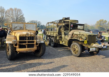 MILAN, ITALY - NOV 1: Old military truck, Exhibitor sitting in his stand at Militalia, exhibition dedicated to militaria collectors and military associations on November 1, 2014 in Milan.