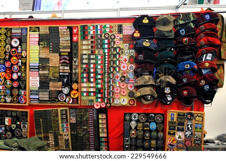 MILAN, ITALY - NOV 1: Miscellaneous items , Exhibitor sitting in his stand at Militalia, exhibition dedicated to militaria collectors and military associations on November 1, 2014 in Milan.