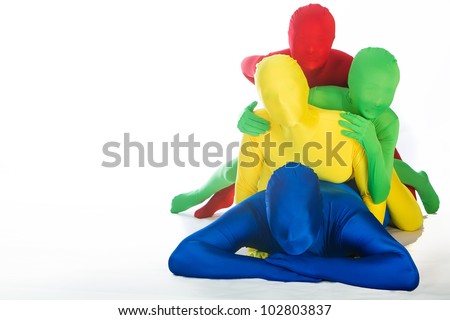An abstract family of four wearing bright, colorful body suits.  Primary colors of red, blue, green and yellow.